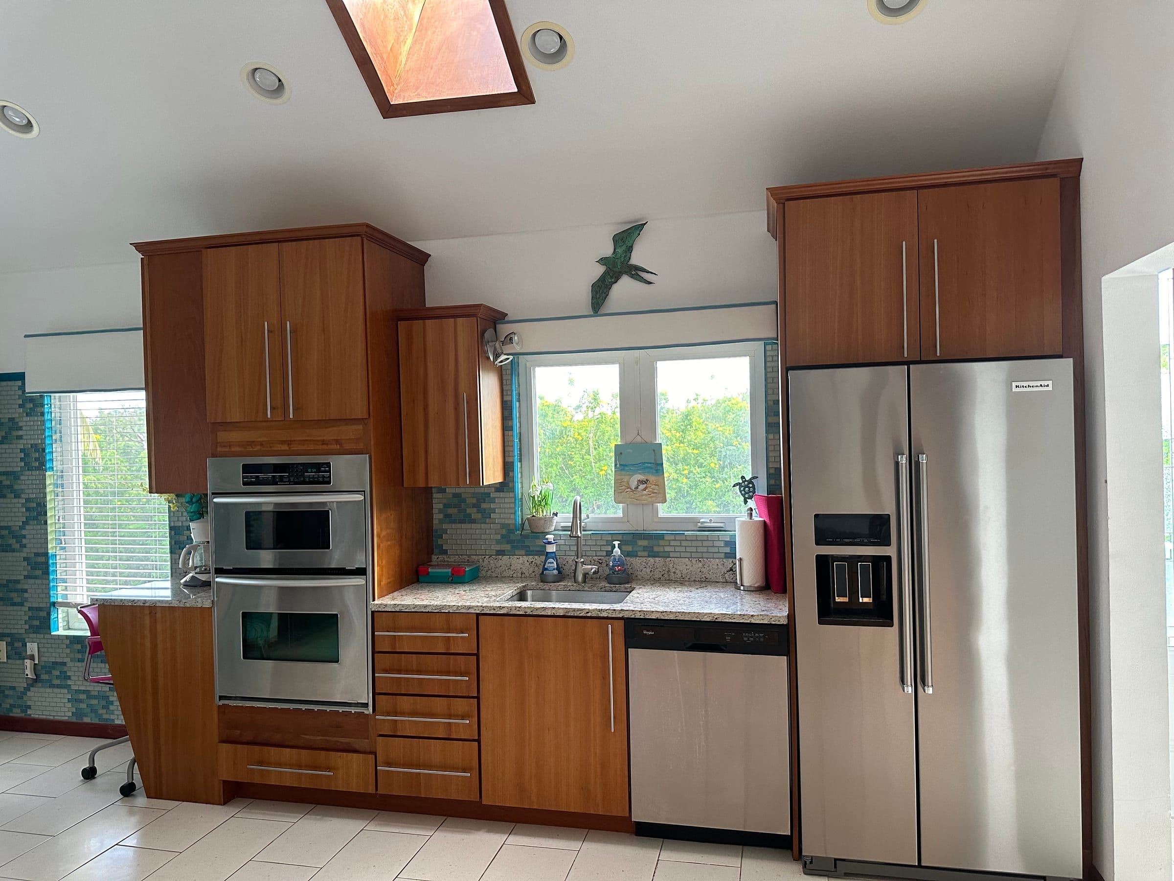 The kitchen at Rum Barron. Stainless appliances, granite counters, skylight overhead.
